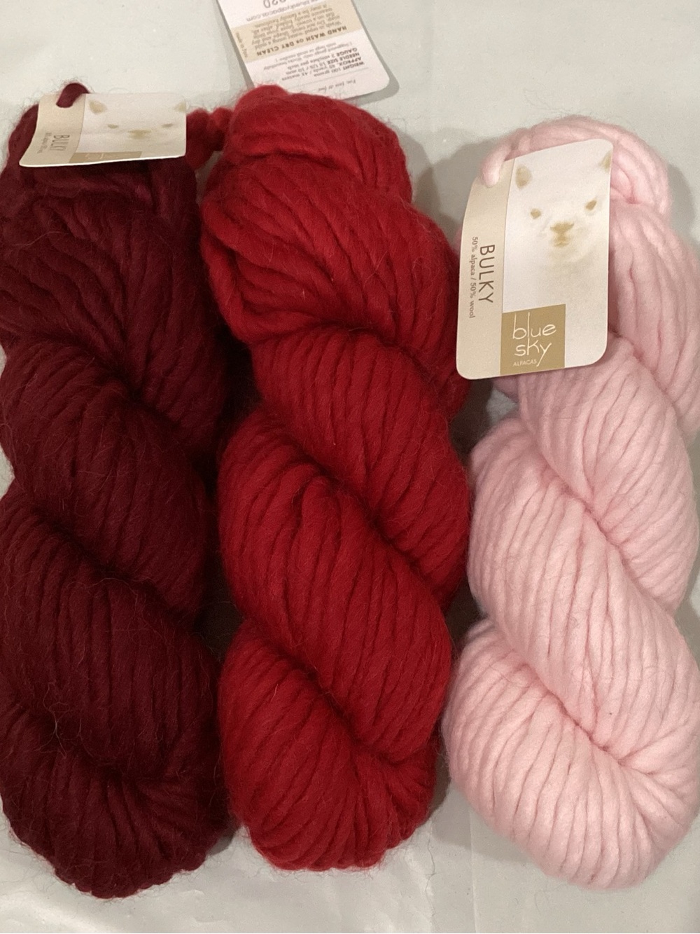 3 hanks of blue sky alpaca bulky weight yarn in coordinating colorway